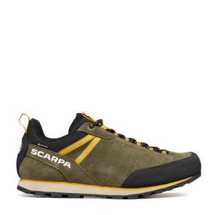 Green and black hiking shoe with yellow accents on a white background