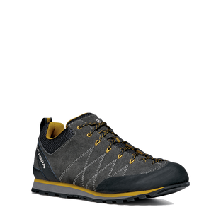 Gray and yellow hiking shoe on a white background